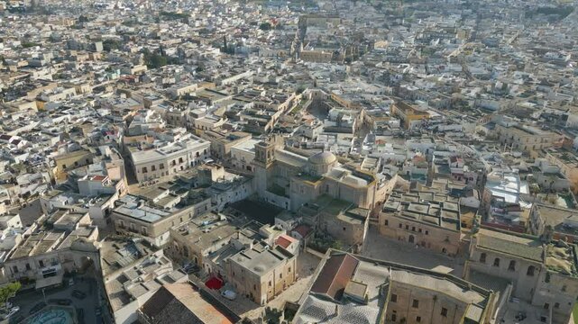 Aerial drone video of the old town center in Mesagne in Puglia, southern Italy.