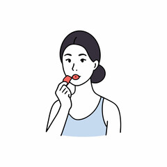 Woman applying lip balm
