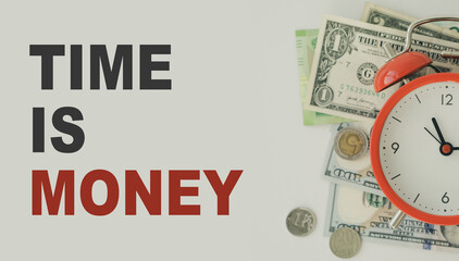 Alarm clock and dollars, close up. Time is money. Gray alarm clock on money banknotes Dollars,...