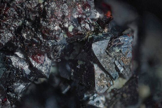 Mineral Cuprite (red copper ore) and silver crystals. High magnification microphotography- scale of photography 10X. Micro lens field of view 4 mm