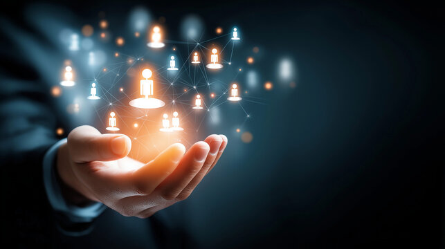 Hand holding digital network of connected people symbols illustrating social connections and technology advancements