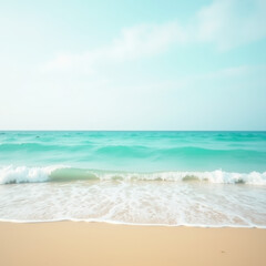 Calm sea and sandy beach under a clear, bright sky.