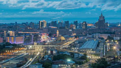 Fototapeta premium Panoramic view to Kiev Railway Station night to day timelapse and modern city in Moscow, Russia