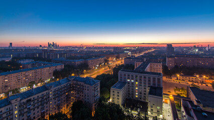 Obraz premium Residential buildings, Stalin skyscrapers and panorama of city before sunrise night to day timelapse in Moscow, Russia
