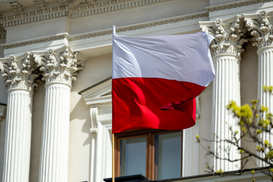 Polish national flag in Warsaw – patriotism and street scenes
