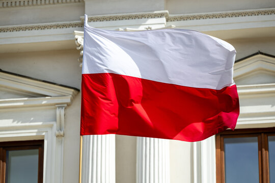 Polish national flag in Warsaw – patriotism and street scenes