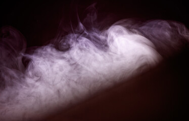 Fototapeta premium A thick cloud of smoke is rising from a fire