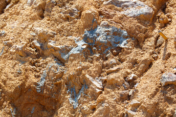 A rocky hillside with a mixture of dirt and rocks