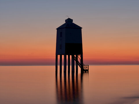 sunset on the low lighthouse at Burnham on sea in England