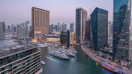 Obraz premium Beautiful aerial top view day to night transition timelapse of Dubai Marina canal