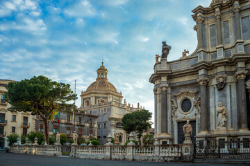 Cathedral Square with the Abbey Church of St. Agatha in Catania, Sicily, Italy, with part of the cathedral facade in the foreground