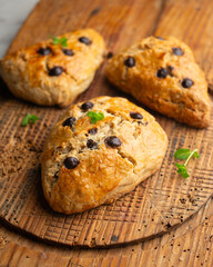 Triangular English scones with dark chocolate chips.