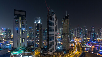 Water canal on Dubai Marina skyline at night timelapse.