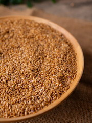 Organic golden flaxseed, linseed grains. Superfood high in fiber.