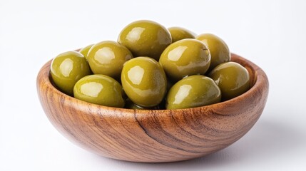 Photo of green olives in a wooden bowl, indicative of Mediterranean cuisine and a healthy snack option.