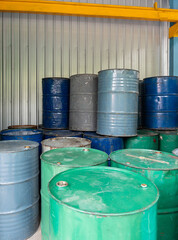 Neatly Arranged Oil Drums in Factory Warehouse.