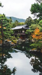 Fototapeta premium Serene Japanese garden house reflected in a tranquil pond.
