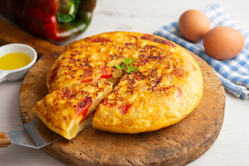 Traditional Spanish omelet with potato, egg, and red pepper. A traditional Spanish tapas recipe.