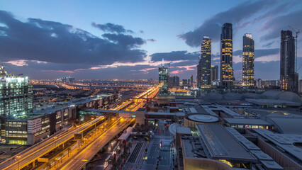 Obraz premium Aerial view of Financial center road night to day timelapse with under construction building