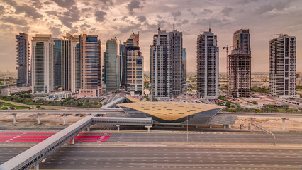 Naklejka premium Aerial top view to Sheikh Zayed road during sunrise near Dubai Marina and JLT timelapse, Dubai.