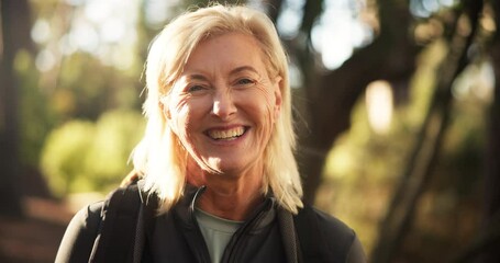 Hiking, mature woman and face in woods for adventure, retirement hobby and cardio wellness. Senior person, smile and portrait with backpack for trekking, explore and holiday sightseeing in forest - Powered by Adobe