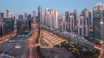 Panorama of Business bay Dubai night to day aerial timelapse.