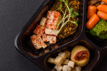 Food bowl with tofu, quinoa, broccoli and carrots, microgreens