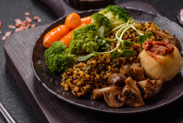 Food bowl with tofu, quinoa, broccoli and carrots, microgreens