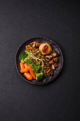 Food bowl with tofu, quinoa, broccoli and carrots, microgreens