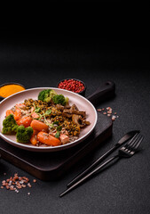 Food bowl with tofu, quinoa, broccoli and carrots, microgreens