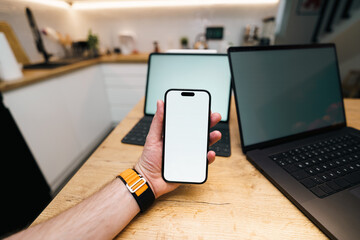 smartphone white screen mockup home kitchen interior laptop tablet on table