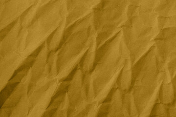 Abstract wrinkled golden crumpled paper texture background