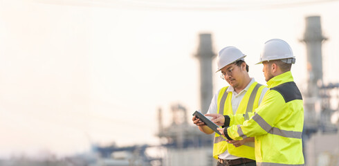 Group Asian man petrochemical engineer working at oil and gas refinery plant industry factory,The...