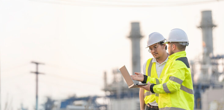 Group Asian man petrochemical engineer working at oil and gas refinery plant industry factory,The people worker man engineer work control at power plant energy industry manufacturing