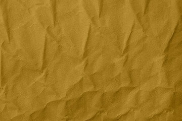 Abstract wrinkled golden crumpled paper texture background