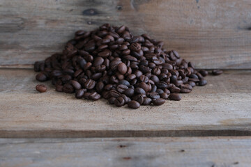 Coffee beans on a wooden background