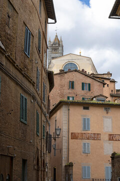 Fototapeta Siena old town narrow streets with medieval buidings, Tucany, Italy.