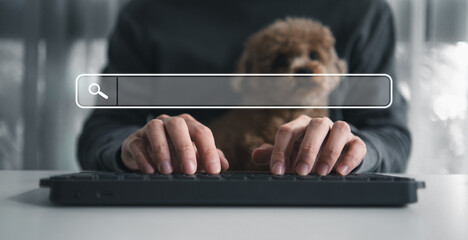 Search data and SEO technology, Hand typing on laptop keyboard searching for information on the website. Online networking system, Using Search Console. Dog sitting with owner while working