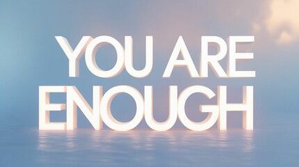 Fototapeta premium Uplifting white bold text “You Are Enough” with soft under-glow, minimal background, designed for online inspiration