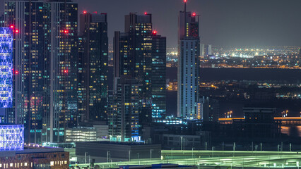Aerial skyline of Abu Dhabi city centre from above night timelapse