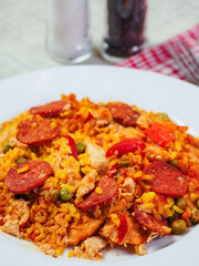 Close up of fine tasty Spanish paella dinner with rice and high quality chorizo sausage. Mediterranean style dish. Popular food made from premium ingredients.