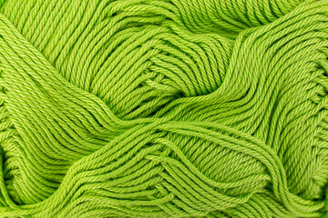 Mint green thread spool close up , abstract crochet backdrop