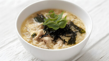 Light and Creamy Japanese Rice Porridge Zosui with Fresh Herbs and Seaweed Garnish