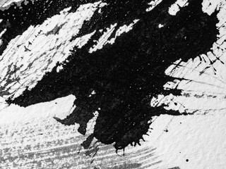 spots of black ink on white paper