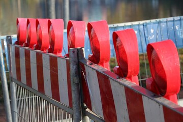 close-up of a construction site barrier with warning lights
