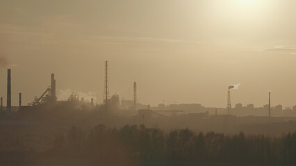 Obraz premium The Industrial Landscape Beautifully Captured Under a Hazy Sky at Dusk Time of Day