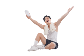 Portrait of muscular Asian man in sportswear sitting posing on white background