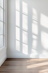 Fototapeta premium Minimalist Interior Renovation Mockup Serene White Wall with Natural Light Casting Soft Window Shadows - Contemporary Design Inspiration