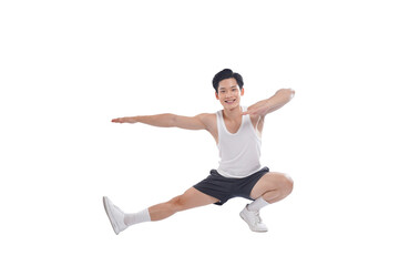 Portrait of muscular Asian man in sportswear working out on white background
