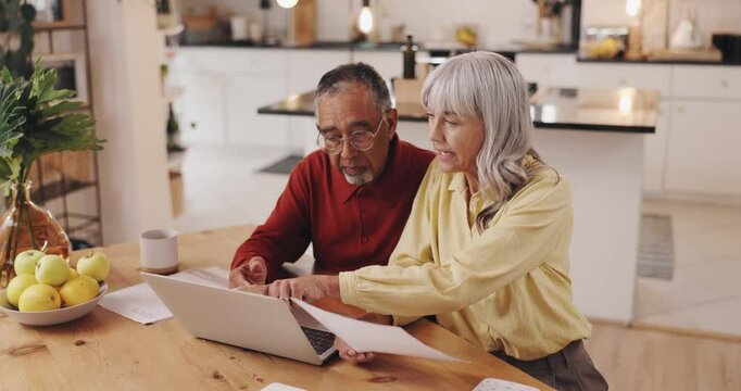 Finance, senior couple and laptop with paperwork in home for asset management, account comparison or planning. Interracial people, budgeting or financial review for retirement fund or pension savings